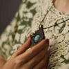 Carved Wood Pendant with Turquoise Gemstone Handcrafted Artistic Exir