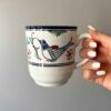 Artistic Ceramic Cup - Handcrafted with White Bird and Flower Painted Design