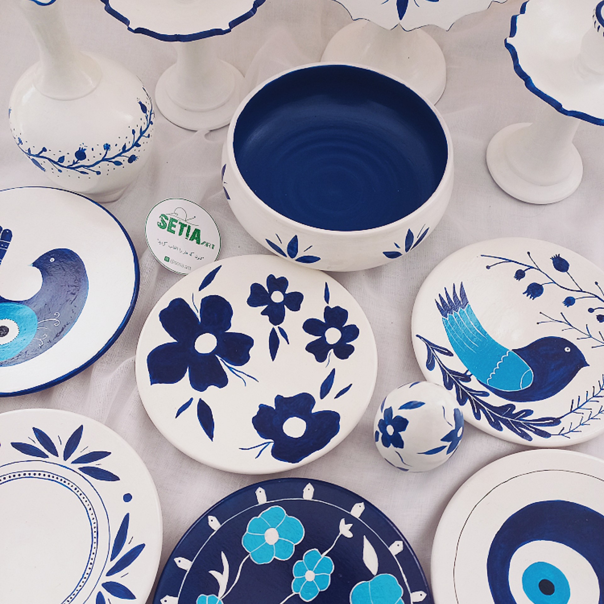 Symbolic Beauty A Hand-Painted Haft Seen Set with Floral, Bird & Evil Eye Motifs Set of 12