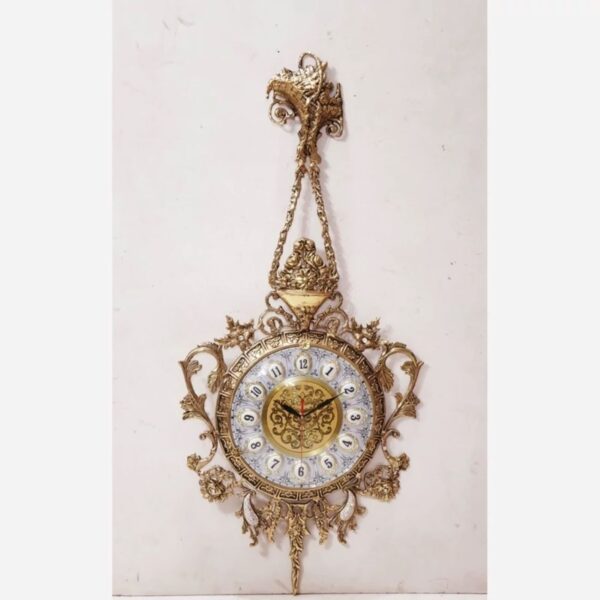 Charming Brass Wall Clock with Decorative Floral Accents and Hanging Detail