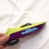 Green Remote-Controlled Waterproof Toy Boat – 4-Channel Radio Control for Water Play (1)