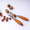 Thumbnail 2: Stylish Wooden-Handled Nutcracker with Durable Metal Body — Perfect for Cracking Almonds, Walnuts, and Hazelnuts