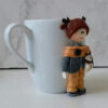 Thumbnail 4: Handmade Ceramic Mug Featuring Boy Doll – Ideal for Tea, Coffee & Cold Drinks