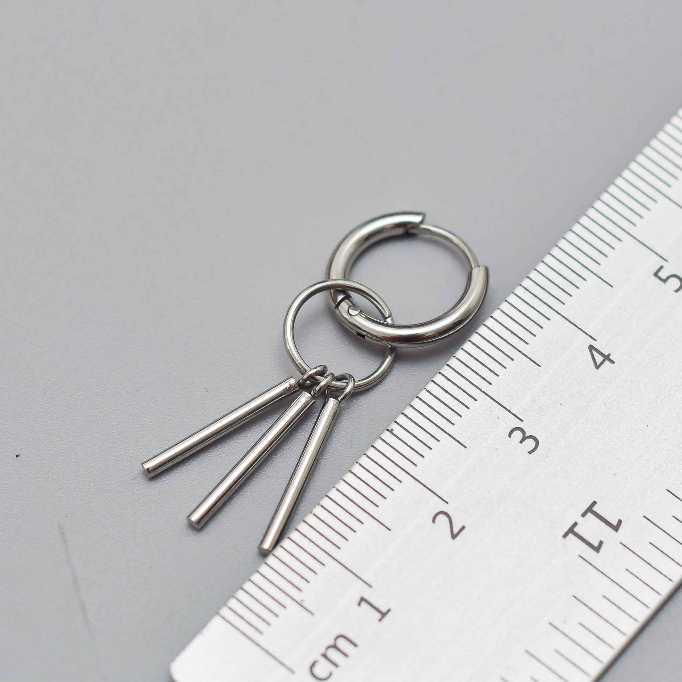 Stainless Steel Asymmetric Hoop Earrings with Tassel Accents – Modern Silver Dangle Pair