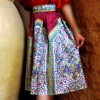 Pleated-Midi-Satin-Skirt-with-Persian-Floral-Motifs-in-Pink-and-Yellow-on-White-1