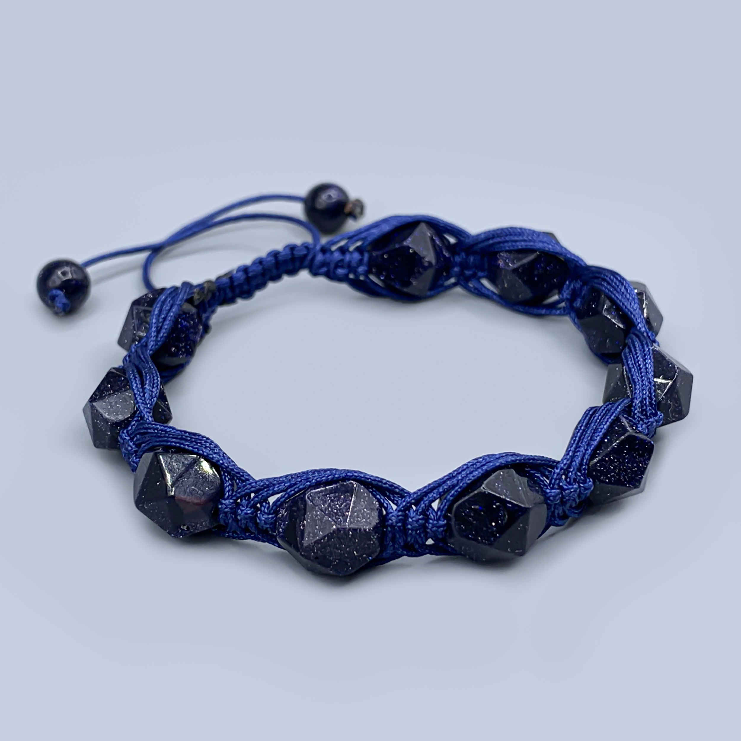 Radiant Men’s Bracelet with Sparkling Goldstone & Deep Blue Braided Cord – Unique Knot Closure