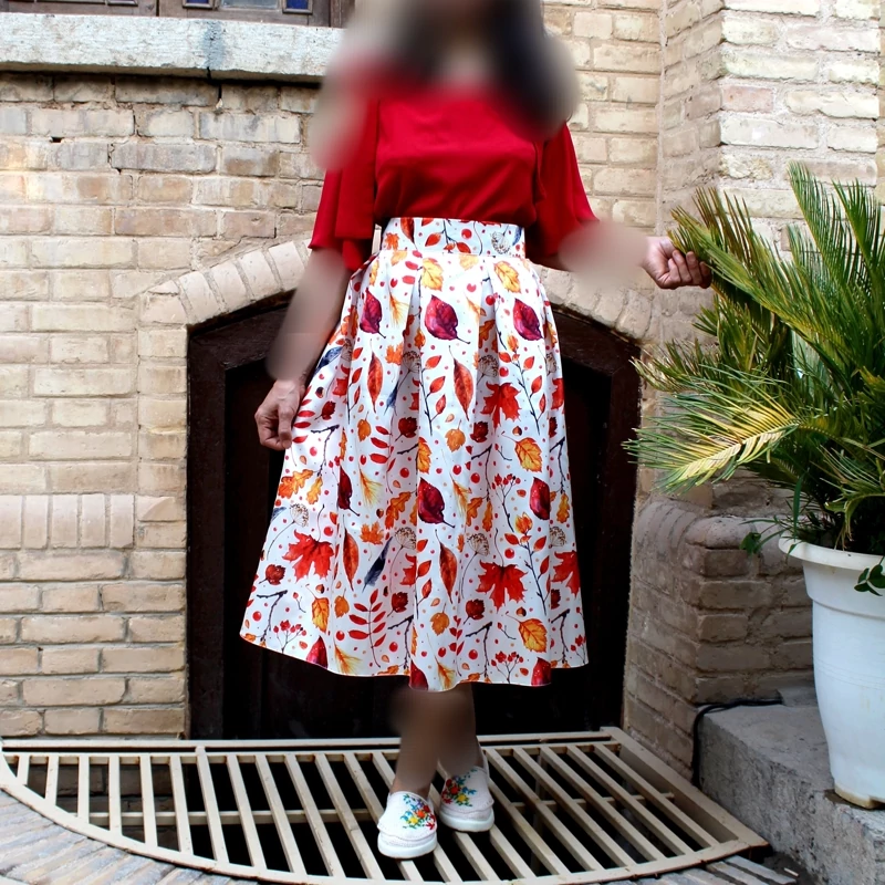 White Midi Pleated Satin Skirt with Autumn Leaf Print and Bold Floral Hem